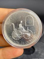 Obverse of the silver coin showing H.S. Taylor Steam Buggy design with 'Canada 20 Dollars' inscription.