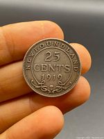 Reverse side showing denomination 25 cents, year 1919, and Newfundland text with floral design