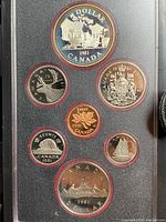 Obverse side showing detailed Canadian coin faces including the queen's profile and denomination images.