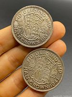 Two silver half crown coins dated 1941 and 1947 showing the reverse side with royal coat of arms and denomination.