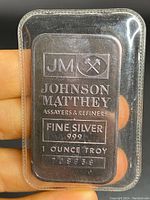Front side of Johnson Matthey silver bar showing logos, text, and serial number.