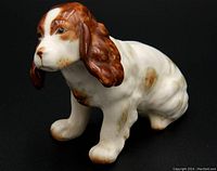 Front angle view of ceramic Cocker Spaniel figurine showing detailed facial features and coloring.
