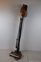 Full view of the Shark Rocket vacuum cleaner standing upright showing the motorized brush head, power cord, and handle.