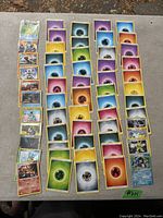 Top-down view of the large spread of Pokémon cards, including energy types and character cards.