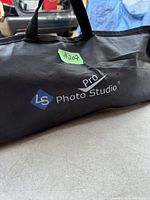 Softbox lighting carrying case with LS Pro Photo Studio logo, black nylon, closed with handles on top.