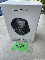 White retail box of smart watch showing product image and features