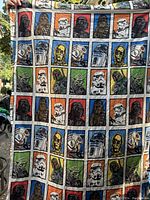 Photo of folded Star Wars top sheet showing multi-character grid pattern with characters like Darth Vader, Stormtrooper, Chewbacca, C-3PO, Yoda, Boba Fett, and R2-D2.