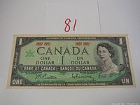 Front side of the 1967 Canadian Centennial one dollar bill showing portrait and text.