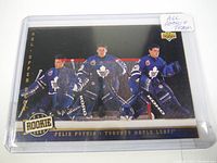 Front of Felix Potvin rookie hockey card in protective sleeve showing three goalie images in Toronto Maple Leafs uniform with net behind them and 'Rookie' and Upper Deck logos.