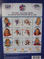Close-up photo of the stamp sheet showing individual stamps featuring hockey players and commemorative graphics for the 50th NHL All-Star Game.