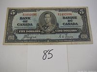 Front side of the 1937 $5 Canadian banknote showing King George VI portrait and serial numbers.