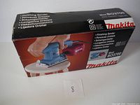 Original box of Makita finishing sander model BO3700 showing packaging and branding