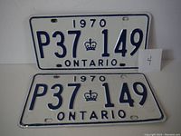 Front and rear view of a pair of 1970 Ontario license plates with registration number P37 149.