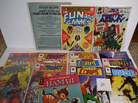 Lot of 14 vintage comic books laid out including Marvel Fun and Games, Army at War, Stormwatch, Magnus Robot Fighter, Speedball, Bambi, and Harbinger titles.
