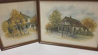 Two framed paintings by J. Anderson showing rural buildings and trees in autumn colors, signed and dated 1979.