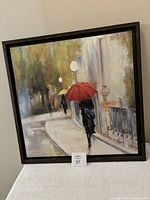 Full front view of framed rainy day print showing dark wood frame and entire artwork.