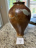 Front three-quarter view of the vase on a granite countertop with numbered card
