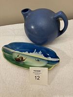 Photo of blue handmade pottery ewer and Noritake painted dish with lot card