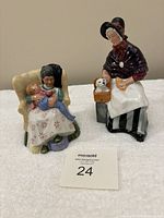 Photo of both Royal Doulton figurines side by side on white surface, showing full size and details
