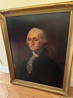 Full view of George Washington portrait in gold wood frame