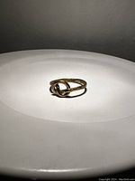 Front view of the handmade knot ring showing the knot detail and round band.