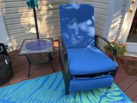 Front view of one deck chair paired with matching end table