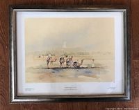 Full framed print behind glass with visible signature and numbering in margin.