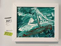 Front view of framed original painting showing textured brush strokes and colors depicting a sailboat on the sea in abstract style.