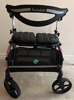 Front view of the walker showing padded seat, carrying case, and front wheels.