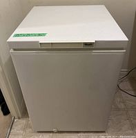 Full frontal view of white Wood's chest freezer, showing its cubic shape and clean lines.