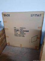 Cardboard packaging box labeled with item details: LK-2420MR, color Espresso, made in Malaysia, caution Handle With Care, item type Mirror.