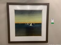 Framed print showing the entire artwork with sailboats on water, set in a dark brown composite wood frame.