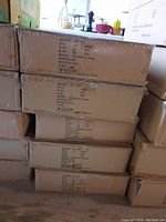 Five stacked cardboard boxes labeled with model WL-301, containing recessed lighting housings.