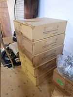 Five stacked cardboard boxes labeled Tooper Pro-LED Lighting Inc., model MIP 456, E-star logo visible