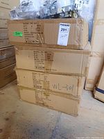 Five stacked cardboard boxes labeled with model number WL-301 containing recessed lighting housings