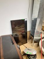 Front view of the Vizio flat screen TV showing the black display, standing upright against a wall.