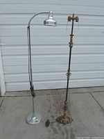 Both floor lamps standing side by side