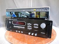 Front view of Sony BDP-S1 stacked on Carver HTR-880 receiver
