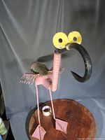 Full view of iron flamingo sculpture front