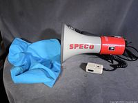 Megaphone, microphone, and blue bag overview