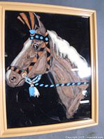 Full view of framed velvet horse painting