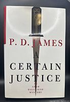 Front cover of P.D. James "A Certain Justice" hardcover book with distinct sword illustration on dust jacket and  red spine