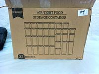 Cardboard box showing illustration of the 32-piece Vtopmart air-tight food storage container set with containers in various sizes.