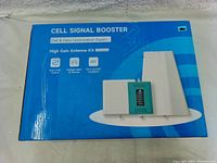 Photo of the product box front side showing product name, image, and key features.