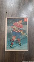 Front side of the 1954 Bert Olmstead Parkhurst hockey card showing player image and card number 5.