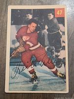 Front of 1954 Keith Allen Parkhurst hockey card shows Allen in red uniform, skating, with card number 47 and signature.