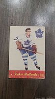 Front of 1955 Parker MacDonald Parkhurst hockey card showing player in Toronto Maple Leafs uniform.
