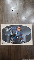 Front of 1962 Larry Hillman Parkhurst hockey card showing player in Toronto Maple Leafs uniform and card number 17.