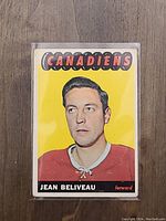 Front of 1965 Jean Beliveau OPC hockey card showing player portrait, Canadiens logo, and name.