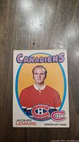Front view of the 1971 hockey card featuring Jacques Lemaire in Montreal Canadiens uniform with team logo and player details.